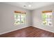 Bedroom with wood-look floors and natural light from two windows at 1844 Hubbell Dr, Mount Pleasant, SC 29466