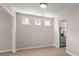 Well-lit dining area with neutral walls and vinyl floors, adjacent to the kitchen area at 1844 Hubbell Dr, Mount Pleasant, SC 29466