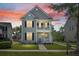Charming two-story home features a welcoming porch and balcony with nicely manicured landscaping at 1844 Hubbell Dr, Mount Pleasant, SC 29466