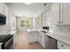 Bright eat-in kitchen with stainless steel appliances, subway tile backsplash, and counter seating at 1844 Hubbell Dr, Mount Pleasant, SC 29466