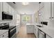 Bright kitchen with stainless steel appliances, stylish countertops, and eat-in dining area at 1844 Hubbell Dr, Mount Pleasant, SC 29466