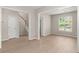 Spacious living room with vinyl floors, neutral paint, and staircase access at 1844 Hubbell Dr, Mount Pleasant, SC 29466