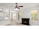 This living room is enhanced by the stone fireplace and plenty of natural light at 1844 Hubbell Dr, Mount Pleasant, SC 29466