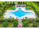 Aerial shot showcases a community pool with ample seating and shaded areas, surrounded by well-maintained landscaping at 1844 Hubbell Dr, Mount Pleasant, SC 29466