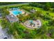 Aerial view of a community pool, playground and green spaces in a well maintained recreational area at 1844 Hubbell Dr, Mount Pleasant, SC 29466