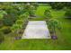 Aerial shot showcasing a community volleyball court surrounded by palm trees and lush green landscaping at 1844 Hubbell Dr, Mount Pleasant, SC 29466