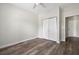 Bedroom featuring wood-look floors, a closet with double doors, and a ceiling fan at 1915 Chatelain Way, Mount Pleasant, SC 29464