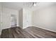 Bedroom featuring wood-look floors, ceiling fan, and access to an en-suite bathroom at 1915 Chatelain Way, Mount Pleasant, SC 29464