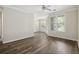 Spacious living room with wooden floors, large windows, and access to an outdoor patio at 1915 Chatelain Way, Mount Pleasant, SC 29464