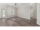 Open living room with wooden floors, natural light, and access to outdoor spaces at 1915 Chatelain Way, Mount Pleasant, SC 29464