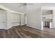 Bright living room with wooden floors, built-in shelves, and easy access to the kitchen at 1915 Chatelain Way, Mount Pleasant, SC 29464