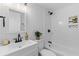 Bright white bathroom with a shower/tub and classic fixtures at 1915 Quitman St, North Charleston, SC 29405