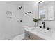 Modern bathroom with tiled shower and decorative accents at 1915 Quitman St, North Charleston, SC 29405