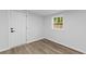 Bedroom with wood floors, natural light, and a white door at 1915 Quitman St, North Charleston, SC 29405