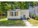 Charming bungalow with a quaint front porch and lush landscaping at 1915 Quitman St, North Charleston, SC 29405