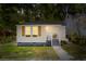 Charming home featuring fresh paint, inviting front porch, and meticulously manicured landscaping at 1915 Quitman St, North Charleston, SC 29405