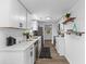Modern kitchen features white cabinetry, stainless steel appliances, and wood floors at 1915 Quitman St, North Charleston, SC 29405