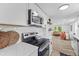 Modern kitchen with stainless steel appliances and open view to the living room at 1915 Quitman St, North Charleston, SC 29405