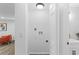 Laundry room with a white cabinet and nearby living area at 1915 Quitman St, North Charleston, SC 29405
