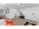 Open-concept living room features updated flooring, trim, and lots of natural light at 1915 Quitman St, North Charleston, SC 29405