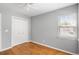 Bedroom featuring window, bi-fold closet, and hardwood flooring at 2009 Arundel Pl, Mount Pleasant, SC 29464