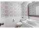 Charming half bath featuring stylish wallpaper, wainscoting, and a modern vanity with a vessel sink at 2009 Arundel Pl, Mount Pleasant, SC 29464