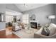 Bright and airy living room with hardwood floors, a fireplace, and comfortable seating for Gathering and friends at 2009 Arundel Pl, Mount Pleasant, SC 29464