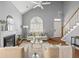 Cozy living room featuring a fireplace, vaulted ceilings, and an abundance of natural light at 2009 Arundel Pl, Mount Pleasant, SC 29464