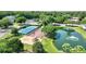 Aerial view of the community with a playground, tennis court, and pond with a fountain at 2011 N Highway 17 # 1400P, Mount Pleasant, SC 29466