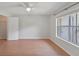 Bright bedroom featuring wood floors, large window, neutral walls, and closet at 2011 N Highway 17 # 1400P, Mount Pleasant, SC 29466