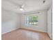 Cozy bedroom with wood floors, ceiling fan, neutral walls, and window overlooking the trees at 2011 N Highway 17 # 1400P, Mount Pleasant, SC 29466