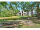 Apartment building overlooking a pond with picnic tables and grill for outdoor enjoyment at 2011 N Highway 17 # 1400P, Mount Pleasant, SC 29466