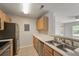 Bright kitchen featuring stainless steel appliances, wooden cabinets, and an open floor plan at 2011 N Highway 17 # 1400P, Mount Pleasant, SC 29466