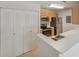 Bright kitchen featuring stainless steel appliances, wooden cabinets, and closet doors at 2011 N Highway 17 # 1400P, Mount Pleasant, SC 29466