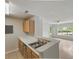 Kitchen with white countertops, stainless steel appliances, wooden cabinets, and an open floor plan at 2011 N Highway 17 # 1400P, Mount Pleasant, SC 29466