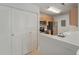 Modern kitchen featuring stainless steel appliances, wooden cabinetry, and closet doors at 2011 N Highway 17 # 1400P, Mount Pleasant, SC 29466