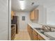Well-lit kitchen featuring stainless steel appliances, tile floors, and wooden cabinetry at 2011 N Highway 17 # 1400P, Mount Pleasant, SC 29466