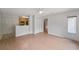 Bright living area with wood-look floors, white ceiling fan and access to the kitchen and balcony at 2011 N Highway 17 # 1400P, Mount Pleasant, SC 29466