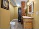 Unique bathroom featuring a brick column, modern washer/dryer, and vanity at 2021 Lakeshore Dr, Charleston, SC 29412