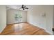 Bright bedroom with hardwood floors and French doors leading to a balcony at 2021 Lakeshore Dr, Charleston, SC 29412