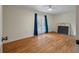 Open bedroom with french doors to a balcony and hardwood floors at 2021 Lakeshore Dr, Charleston, SC 29412