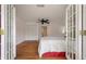 Bedroom with hardwood floors and french doors at 2021 Lakeshore Dr, Charleston, SC 29412