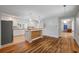 Updated kitchen with white cabinets, butcher block island, and stainless steel appliances at 2021 Lakeshore Dr, Charleston, SC 29412