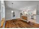 Bright open kitchen featuring an island and stainless steel appliances next to a dining area at 2021 Lakeshore Dr, Charleston, SC 29412
