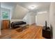 Bright living room with hardwood floors and neutral walls under angled ceiling in a cozy home at 2021 Lakeshore Dr, Charleston, SC 29412