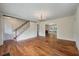 Open concept living area with wood floors and chandelier at 2021 Lakeshore Dr, Charleston, SC 29412