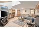 Cozy living room with tile floors, neutral tones, and ample seating adjacent to the kitchen at 2021 Lakeshore Dr, Charleston, SC 29412