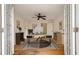 Home office with hardwood floors, desk with computer, and a ceiling fan at 2021 Lakeshore Dr, Charleston, SC 29412