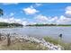 Scenic waterfront vista featuring a tranquil river view with lush greenery and distant homes at 2021 Lakeshore Dr, Charleston, SC 29412