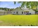 Spacious backyard featuring a well-kept lawn and partial view of the home's exterior at 232 Moon Dance Ln, Summerville, SC 29483